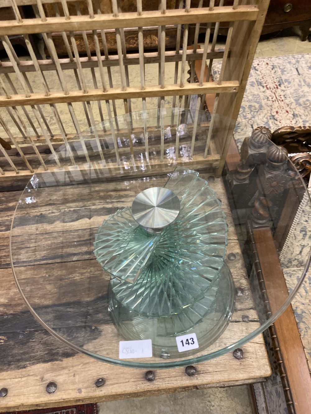 A contemporary circular glass occasional table, diameter 60cm height 50cm